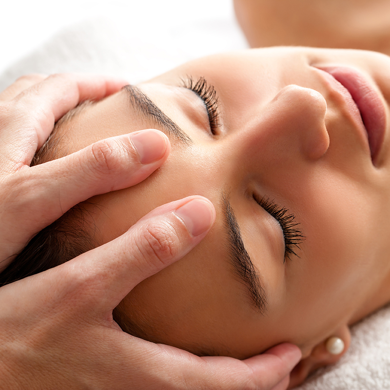 Woman enjoying an Indian head massage